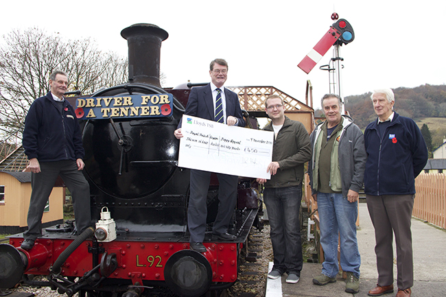 John Haslam handing over cheque